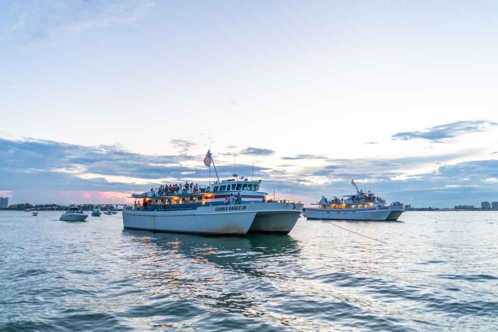 two yachts floating on body of water