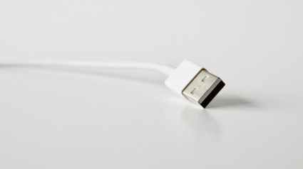 close up photo of white usb cable