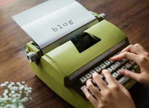 green typewriter written blog