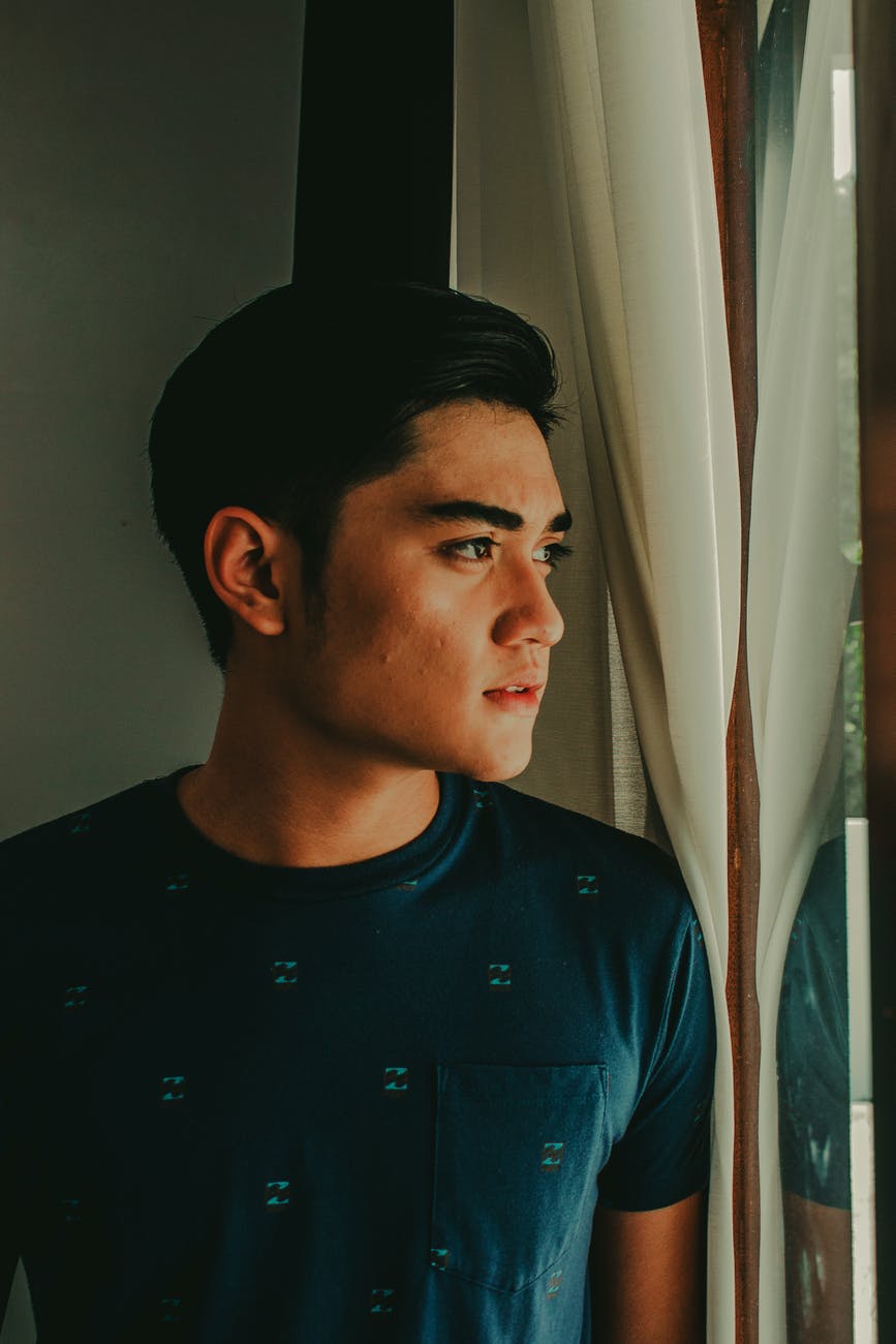 man looking out of the window