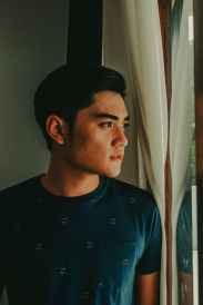 man looking out of the window